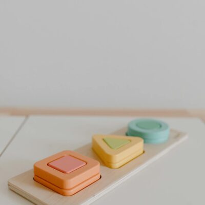 Colorful geometric wooden toy for kids, perfect for early learning and play.